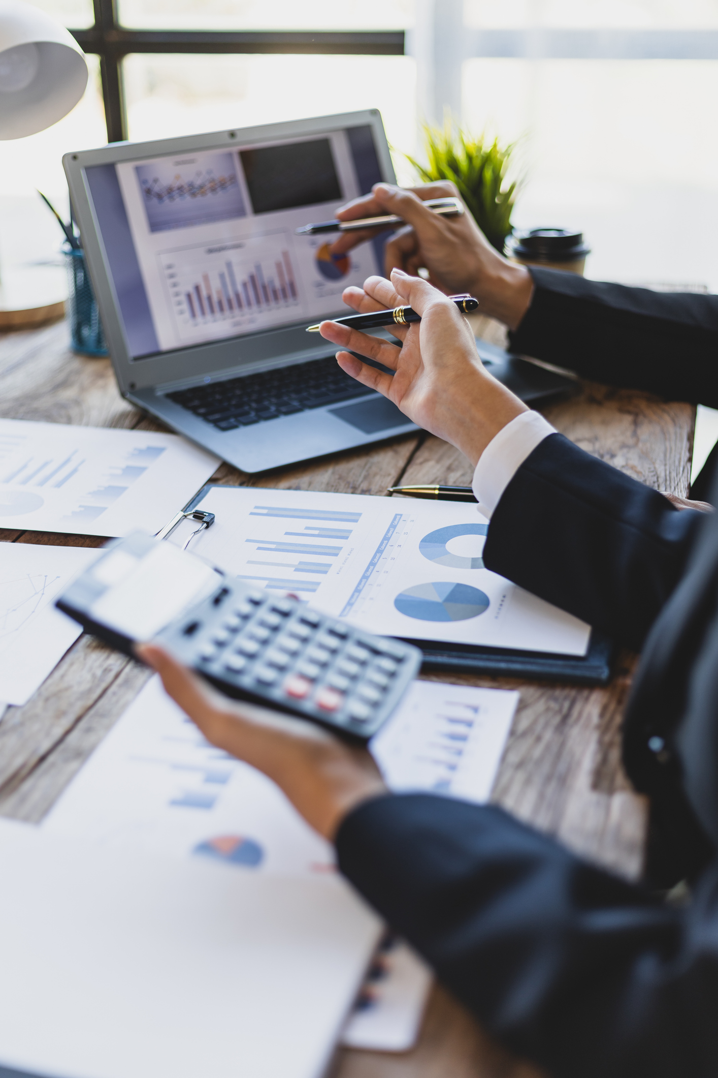 Business people meeting charts